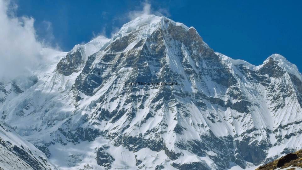 A Mountaineer Standing Top at the Annapurna