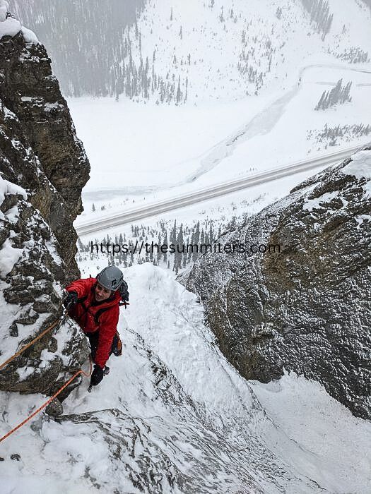 Climbing Mixed Master, with the Icefields Parkway below. Photo: Ian Welsted

