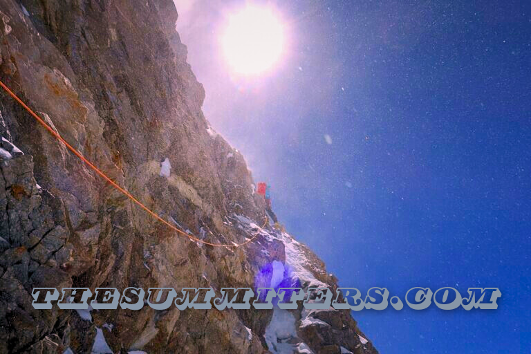 Climbing on mixed terrain and windy conditions. Photo: Tom Livingstone