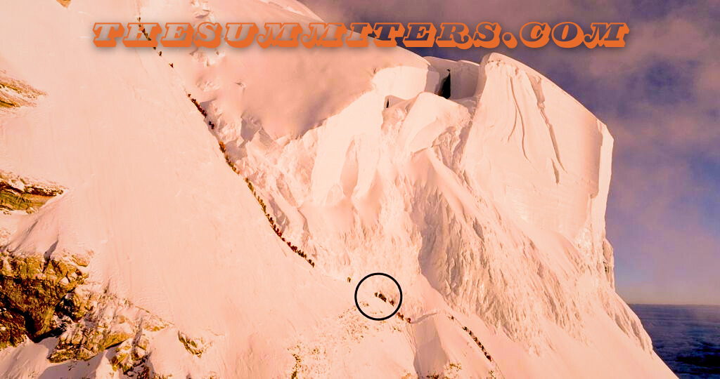 Footage by Philip Flaemig shows a line of climbers under the Great Serac and K2’s Bottleneck, with Hassan’s location circled. Photo: Philip Flaemig/Servus TV